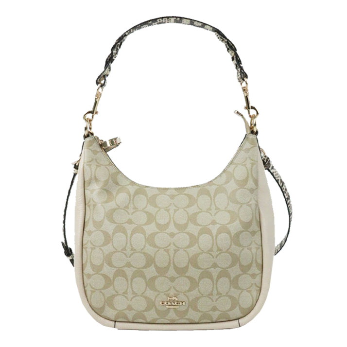 Coach bag. Jules Hobo in signature canvas, leather. 