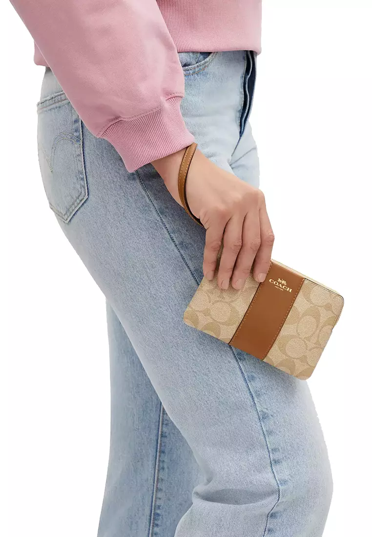 Coach Corner Zip Wristlet In Signature Canvas In Light Khaki Saddle CS602